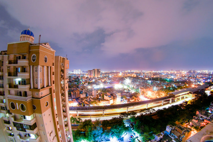 Indian city at night with skyscrapers and lit city streets