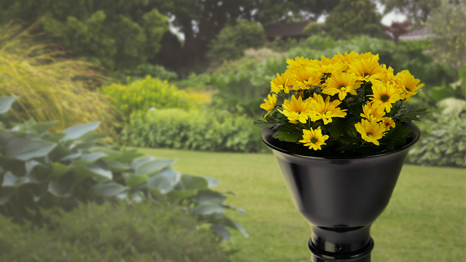 a cast iron bollard with a planter top