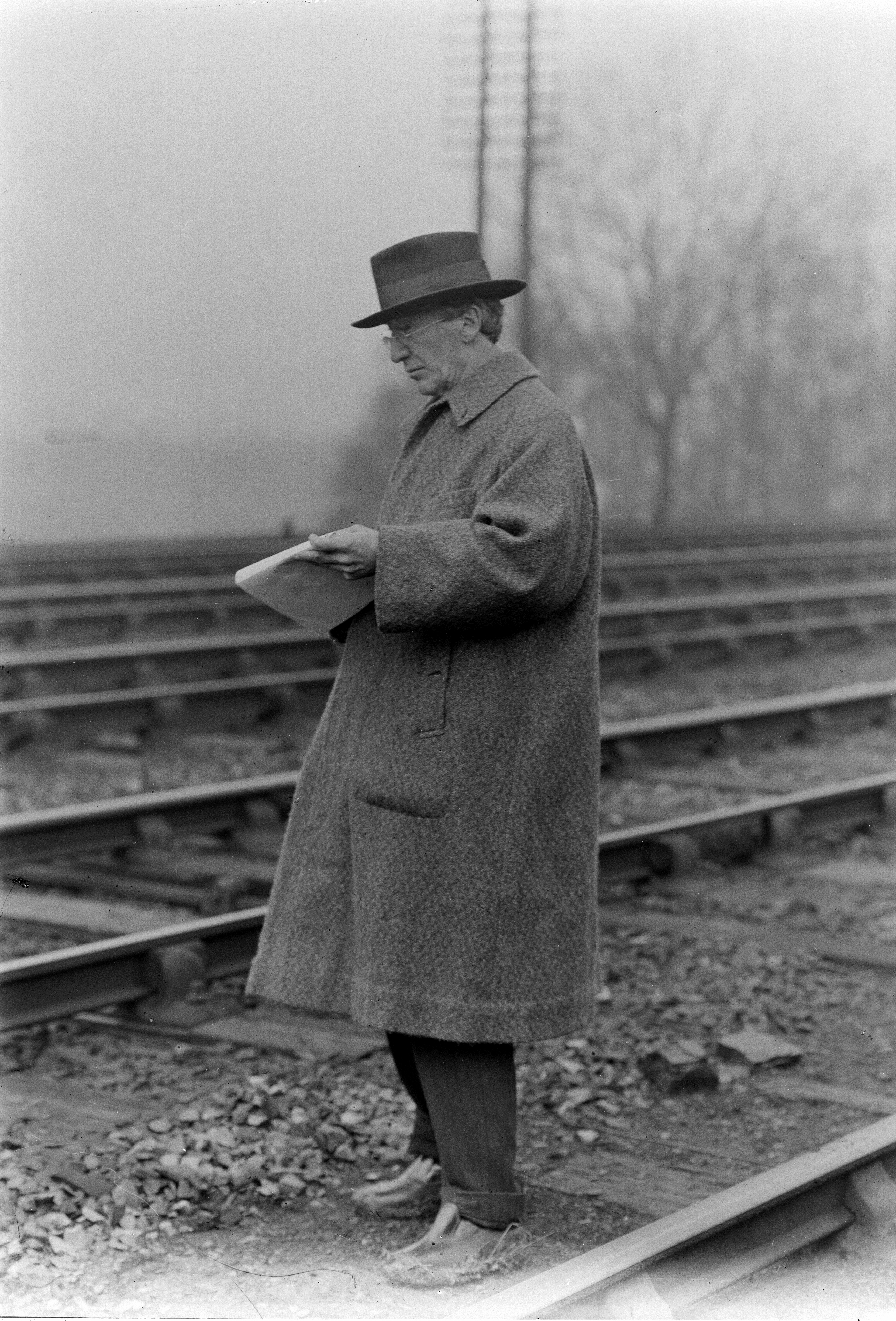 Stanhope Forbes R.A. sketching from life for the poster 'The Permanent Way'.